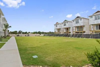 Plenty of space to play!  This large open grassy area is perfect for tossing a football, playing outdoor games, or just enjoying the fresh air.