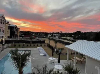 Golden hour perfection.  Watch the sky transform from vibrant hues to twilight magic with stunning seasonal sunsets—all from the comfort of your balcony overlooking the pool.