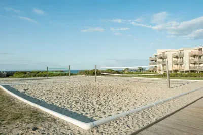 Serve, set, spike!  Guests can enjoy a fun game of sand volleyball right beside the public beach access—just steps from the ocean!
