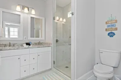 Master bath with beautiful tiled shower and double sinks.