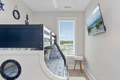 Coastal Comfort for the Kids!  This anchor-themed twin-over-full bunk bed with a twin trundle is perfect for little adventurers. Sleeps up to four, making bedtime a breeze after a fun day at the beach.