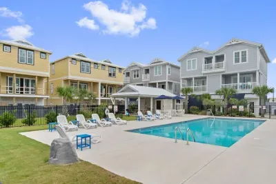 Spend the day enjoying the best of outdoor living!  This poolside pavilion offers built-in charcoal grills, covered picnic tables, outdoor bathrooms, and lounge chairs—perfect for grilling, dining, and relaxing after a swim.