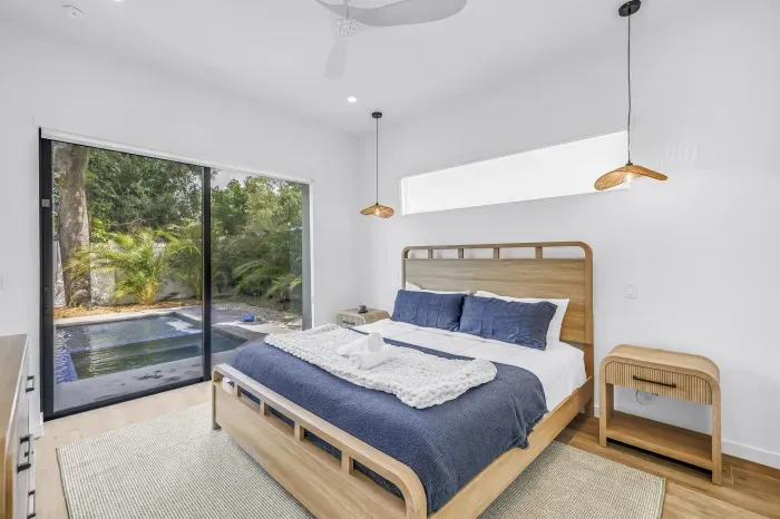 Serene king bedroom with private plunge pool and tropical garden views