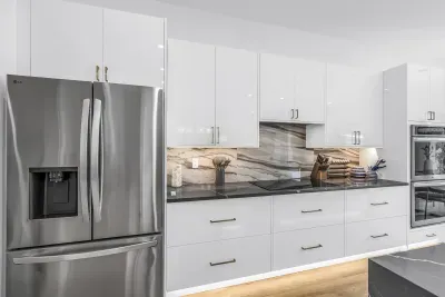 Bright modern kitchen with stainless appliances and elegant finishes