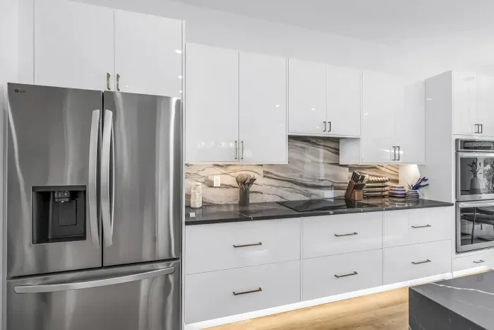 Bright modern kitchen with stainless appliances and elegant finishes