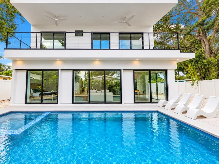 Modern home with private pool, balcony, and bright indoor-outdoor living