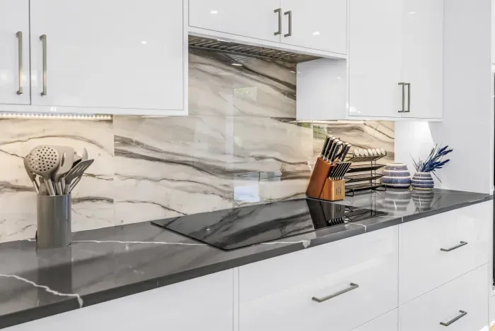 Sleek modern kitchen with marble backsplash and elegant finishes