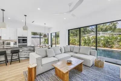 Bright modern living space with pool views and seamless indoor-outdoor flow