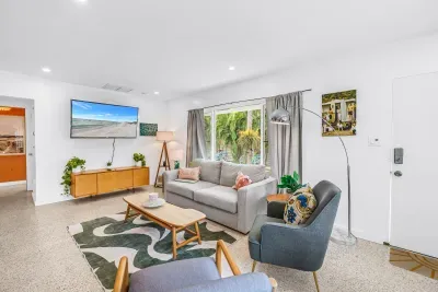 Bright, stylish living room with garden views and cozy modern seating