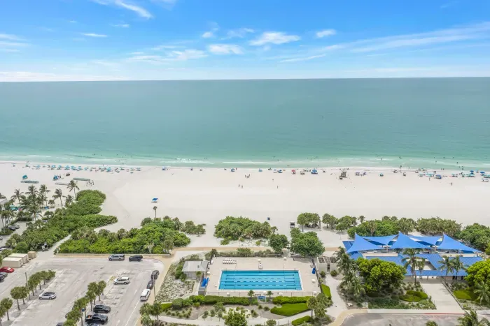 Sweeping ocean views, beach access, and a resort-style pool below