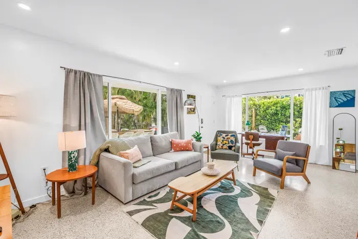 Bright, stylish living room with garden views and abundant natural light
