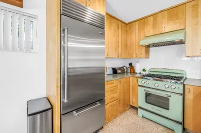 Charming kitchen with retro mint range and premium stainless fridge
