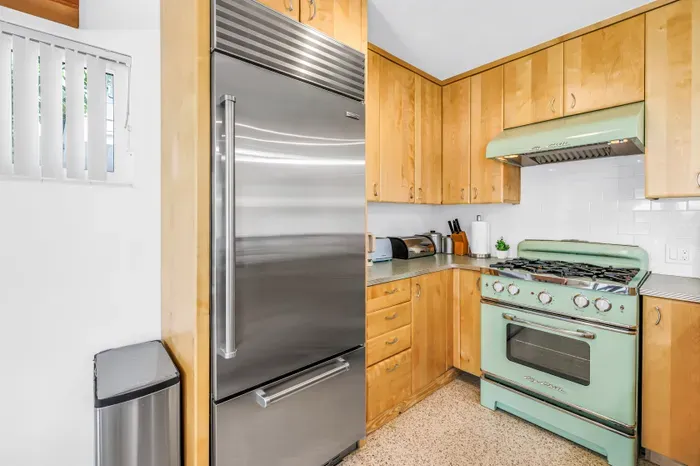 Charming kitchen with retro mint range and premium stainless fridge