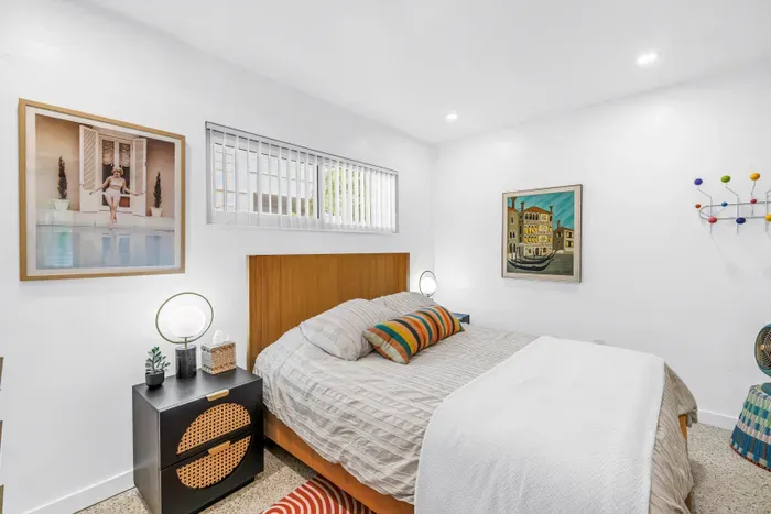 Bright modern bedroom with stylish decor and a cozy, inviting feel