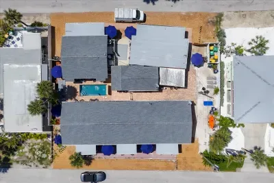 Cozy bungalow compound with pool, courtyard & shaded lounges.