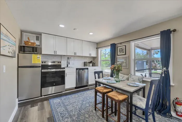 Bright kitchen with stainless appliances and sunny dining nook