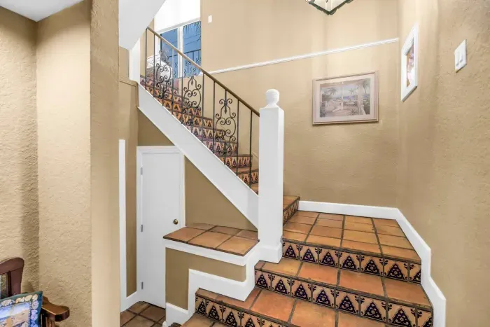 Stairway to Adventure: Bright and inviting, with stunning tile details leading to your getaway!