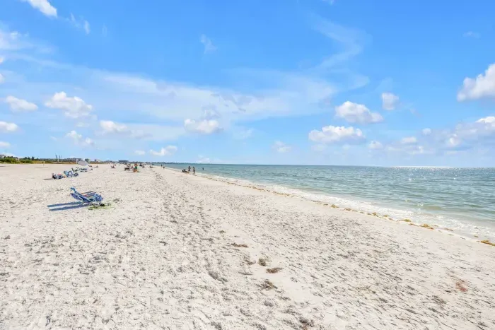 Beachfront Paradise: Step onto powdery sands just steps from your door—sun, surf, and serenity await!