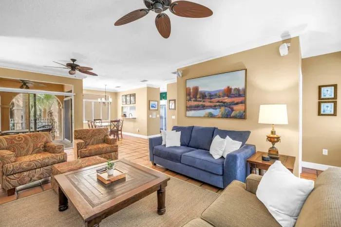 Living Room Oasis: Bright space with stylish seating and views of the lush outdoors!