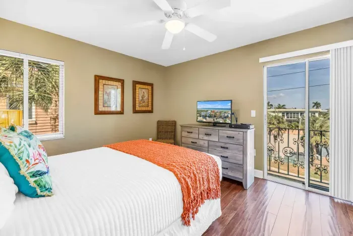 Bedroom Oasis: Enjoy vibrant decor, a sunny view, and comfy vibes in your perfect getaway spot!