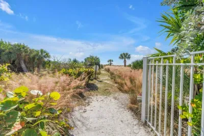 Garden Pathway: Discover your personal paradise leading to sun-kissed shores and vibrant nature!