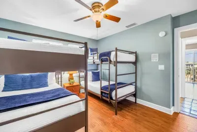 Bunk Room: Fun-filled nights await in this vibrant bunk room with sunlit charm!
