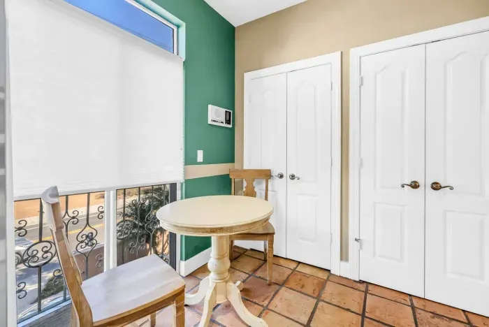 Breakfast Nook: Enjoy sunny mornings at this charming table with vibrant wall accents!