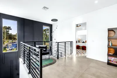Bright modern landing with dramatic windows and sleek contemporary design