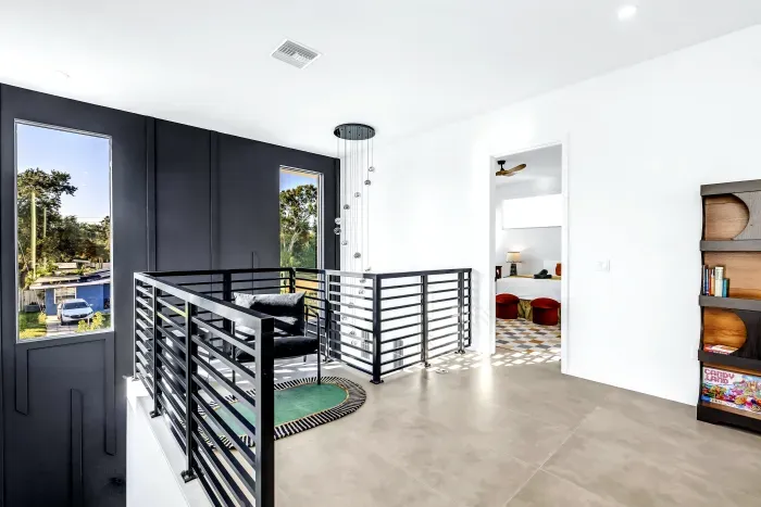 Bright modern landing with dramatic windows and sleek contemporary design