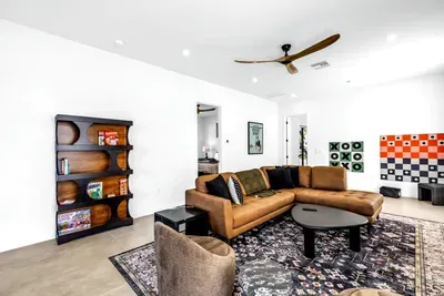 Bright game lounge with spacious sectional and fun family-friendly touches