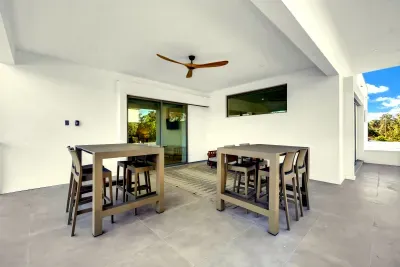 Spacious covered patio with outdoor dining and modern, breezy comfort