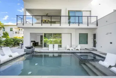Outdoor Oasis: Relax by the pool and soak up the sun in this stylish retreat!