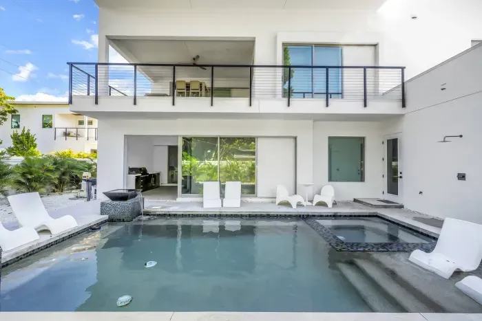 Outdoor Oasis: Relax by the pool and soak up the sun in this stylish retreat!