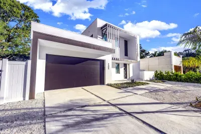 Striking modern home with sleek design, double garage, and upscale curb appeal