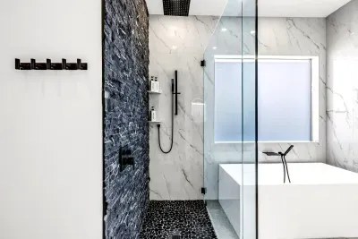 Spa-inspired bathroom with soaking tub, rain shower, and luxe finishes