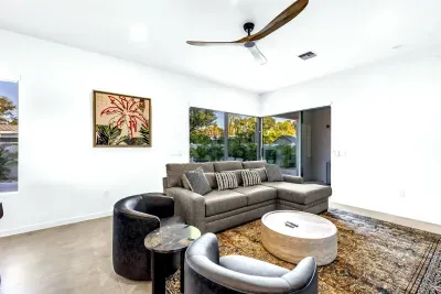 Bright modern living room with corner windows and cozy seating