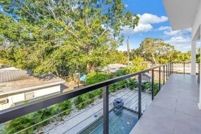 Balcony Escape: Enjoy refreshing breezes and vibrant views from this spacious private balcony!