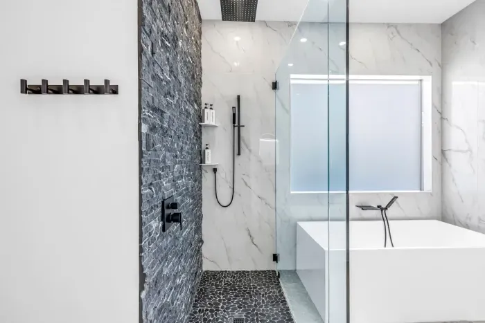 Glass shower detail w/ clean lines and contemporary fixtures.