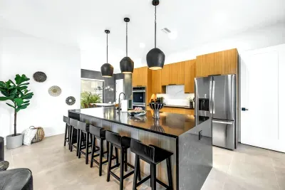 Stylish modern kitchen with oversized island seating and sleek finishes