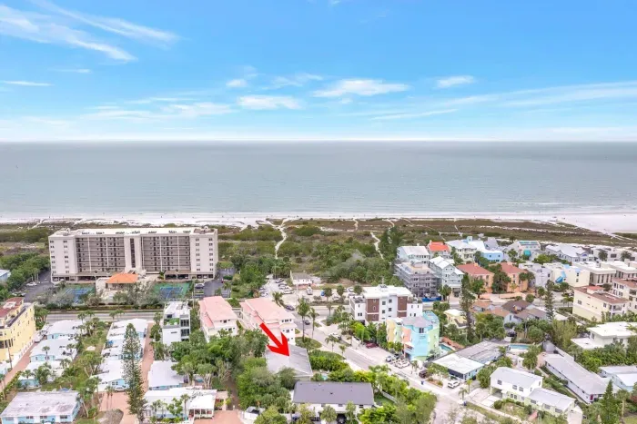 Aerial View: Discover beachside charm with stunning ocean vistas and vibrant local character!