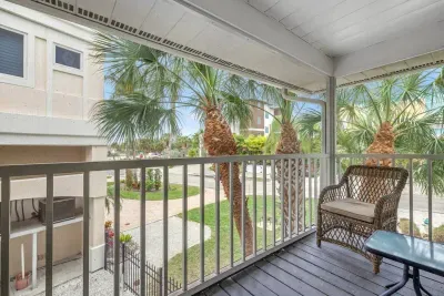 Balcony Oasis: Sip your morning coffee surrounded by swaying palms and sunny vibes!