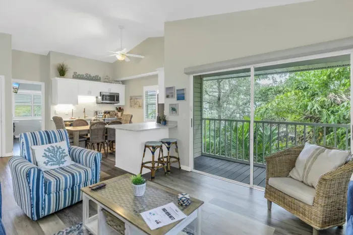 Living Room: Sunlit space with beachy decor, perfect for relaxation and enjoying nature views!