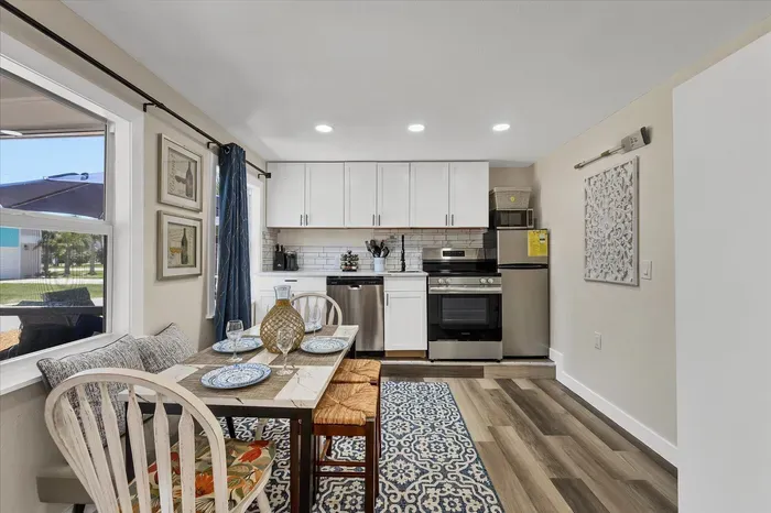 Bright, updated kitchen with cozy dining nook and stainless appliances