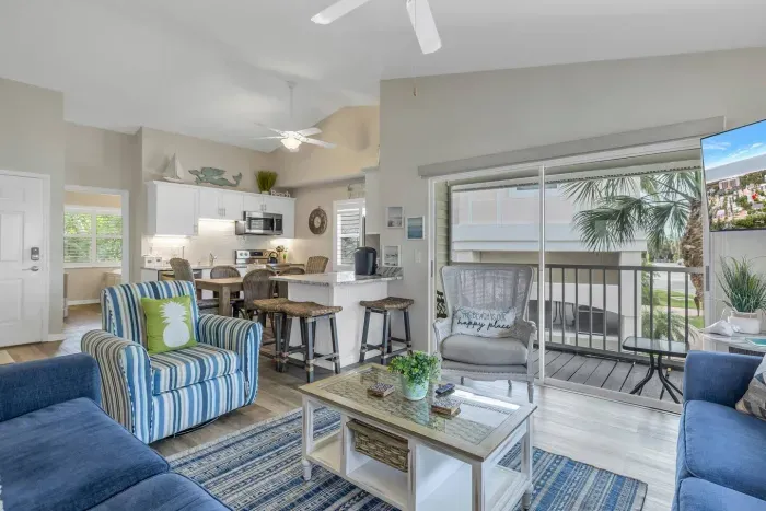 Living Room: Bright and airy oasis with chic decor, inviting seating, and lovely views!