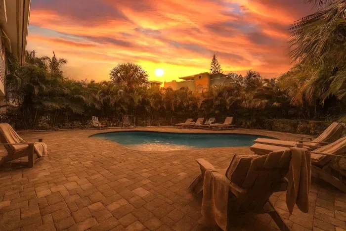 Poolside Paradise: Dive into serenity under vibrant sunsets by the shimmering pool!