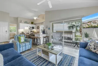 Living Room: Bright and airy space with tropical vibes, perfect for relaxation and fun gatherings!