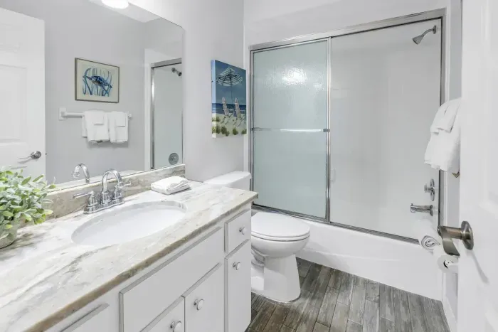 Bathroom Retreat: Modern finishes and beachy decor create a refreshing oasis after a day in the sun!