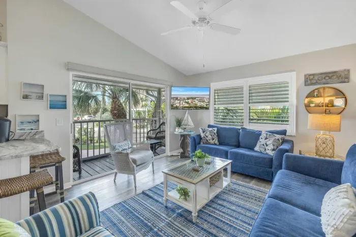 Living Room: Bright and airy retreat with plush seating and tropical views—your ideal relaxation spot!