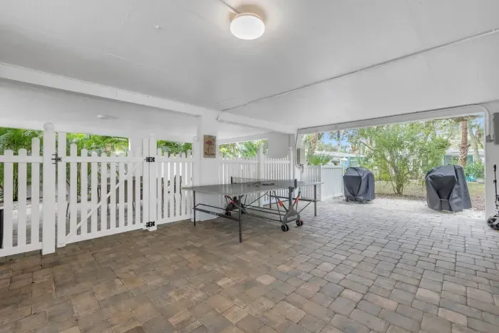 Outdoor Entertainment Space: Enjoy ping pong and BBQs in your tropical retreat paradise!