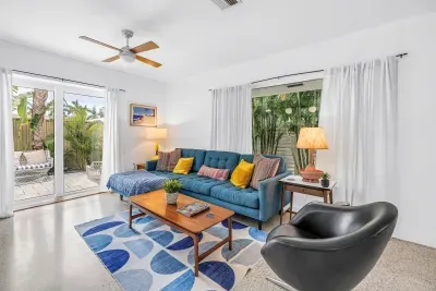 Bright tropical living room with patio access and cozy modern seating